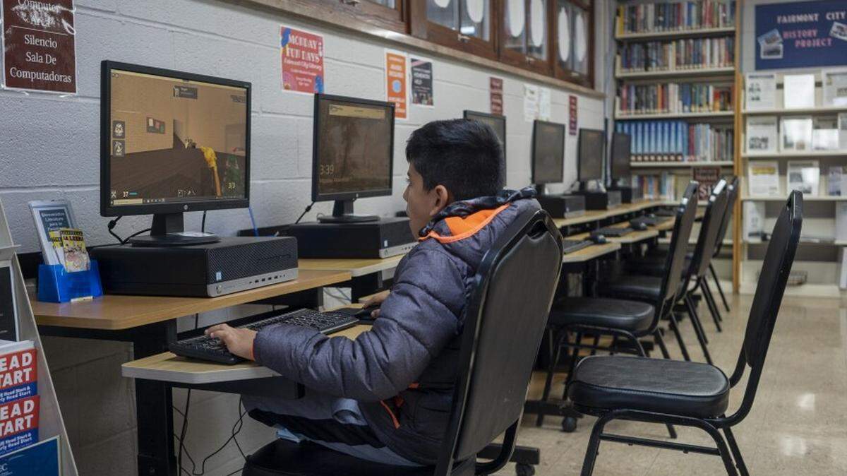 A child plays a computer game in the Fairmont City library on Monday. The library is one of the only places in the small Metro East village that has reliable internet speeds.