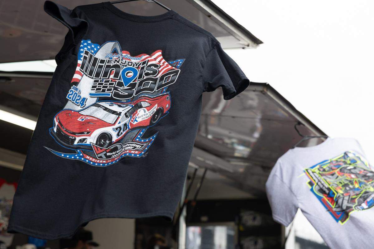 Merch hangs from a seller’s booth during the Enjoy Illinois 300 Cup Race at WorldWide Technology Raceway in Madison, Ill. on June 1, 2024.