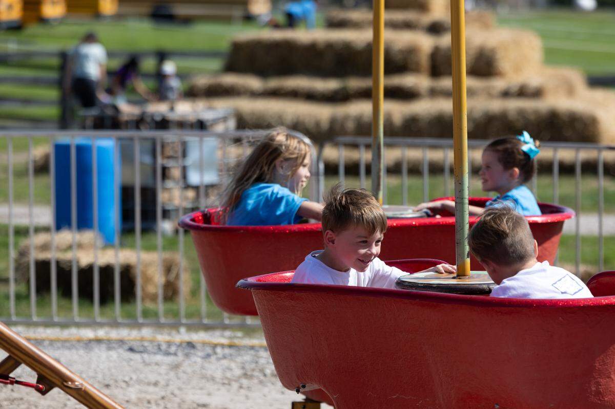 Children enjoy the rides at Eckert’s Fun Farm in Milstadt, Ill.
