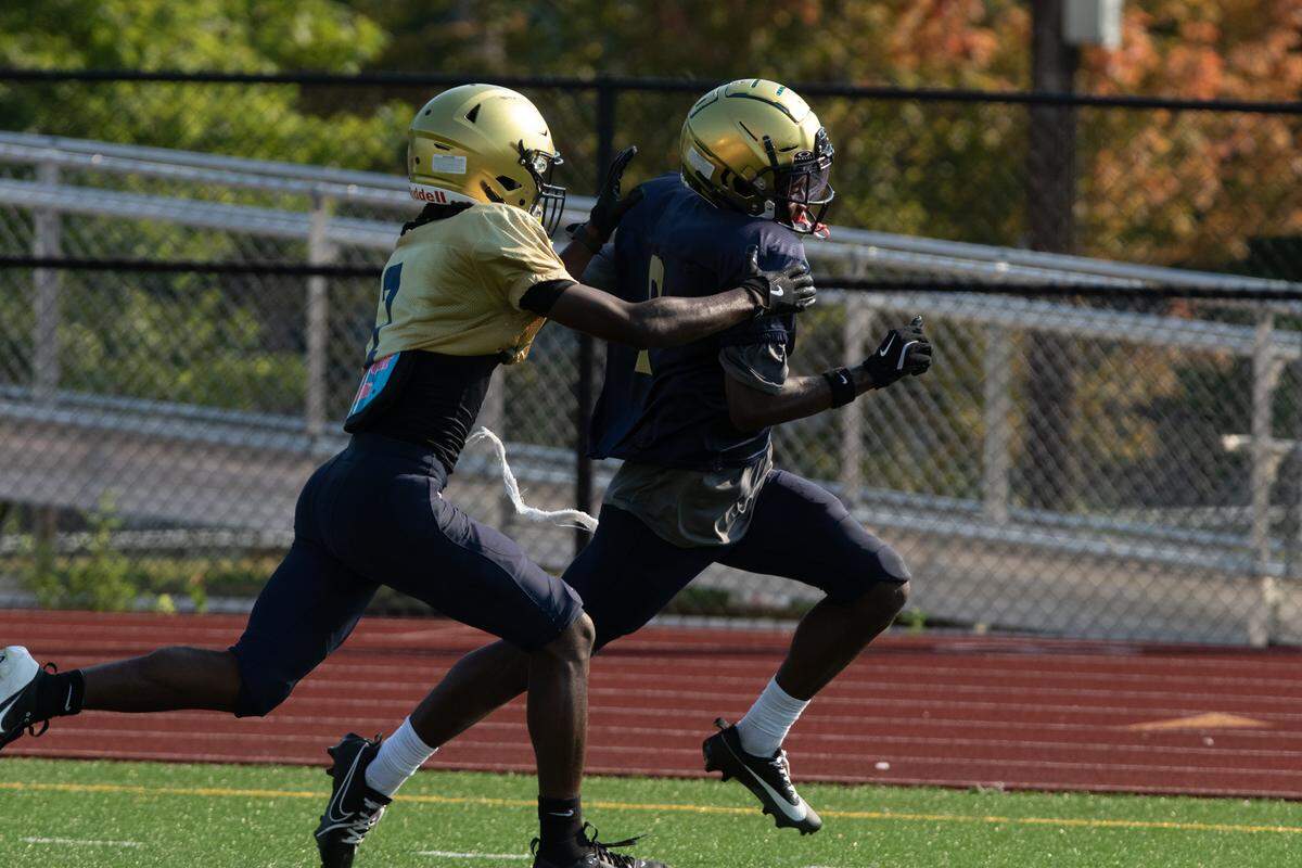 Althoff runningback Logan Thompson dodges a tackle during practice on a hot Saturday morning, two weeks before the first game of the 2025 season.