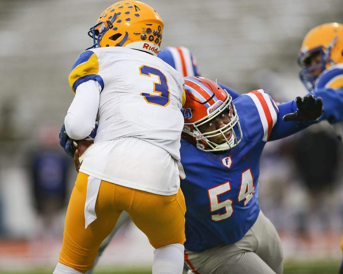 November 12, 2022 - East St. Louis, IL - East St. Louis Daryus Mayo sacks Crete Monee’s quarterback during the IHSA, 6A, Quarterfinal playoff game between Crete - Monee and East St. Louis. The 45-0 victory will advance the Flyers to the Semifinals. [Photo: Chris Johns]