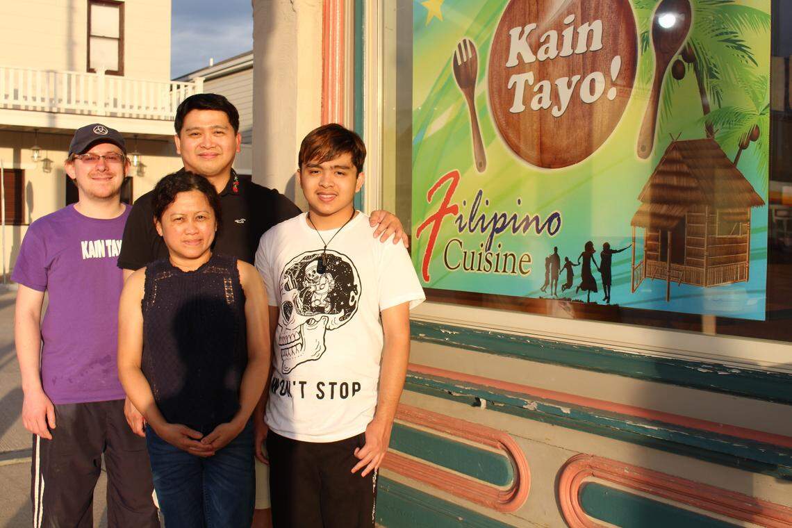 Randy and Sally Arcega, center front and back, operate Kain Tayo Filipino Cuisine in Trenton with help from their son, Jeross, 14, right, and employee Shaun Nelson.