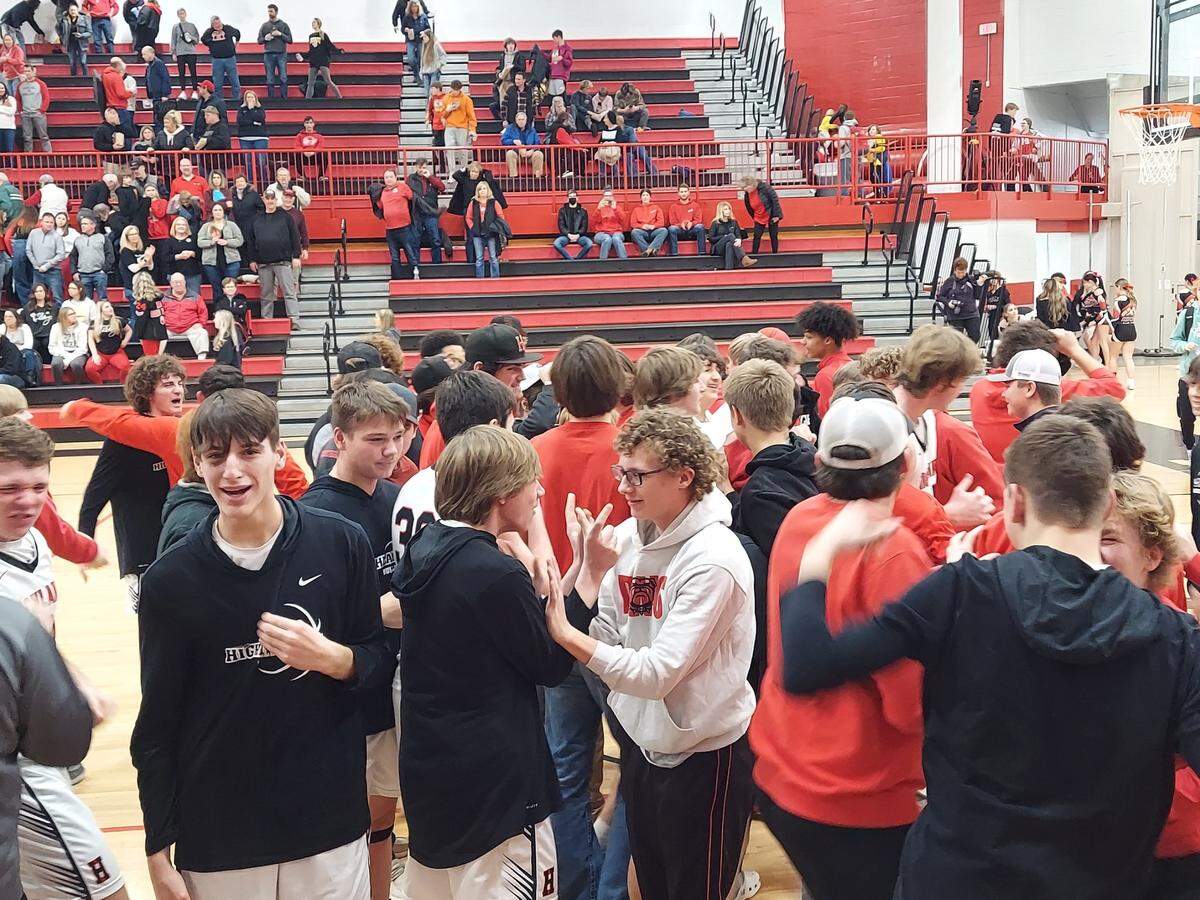 Highland students and fans celebrate the Mississippi Valley Conference victory against Mascoutah. The Bulldogs posted a 51-45 victory.