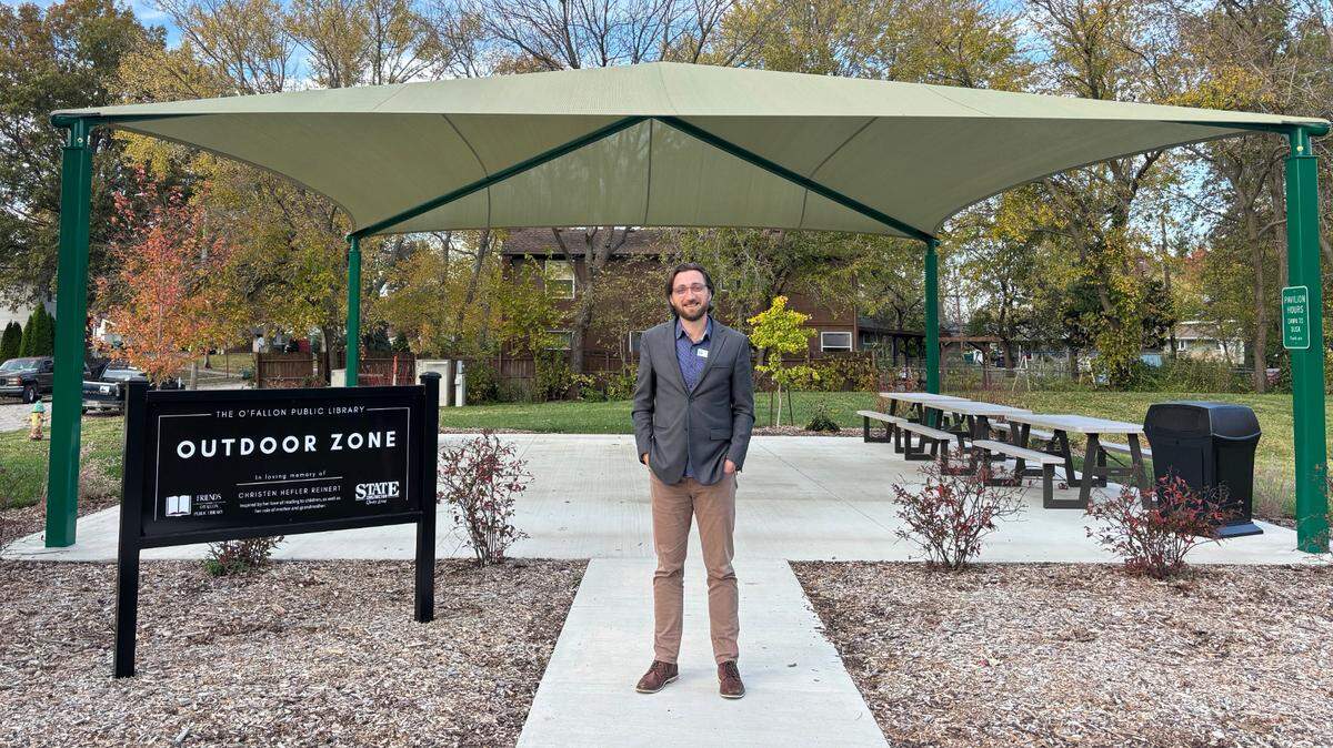 Director Ryan Johnson at the new O’Fallon Public Library Outdoor Zone made possible through donations from Christen Hefler Reinert, the Friends of the Library, and State Construction.