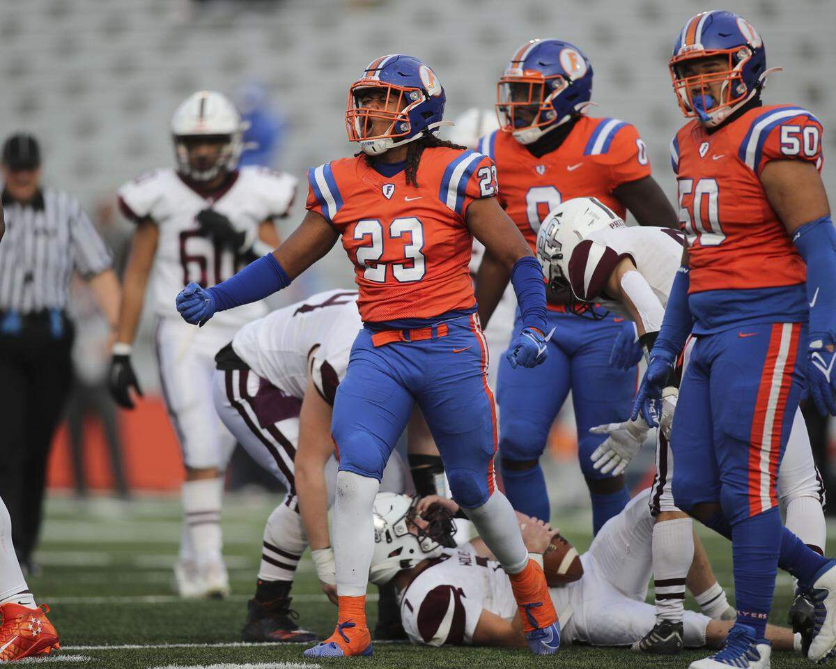 East St. Louis linebacker Bryce Harrison celebrates after sacking the Prairie Ridge quarterback during the IHSA Class 6A state championship game.