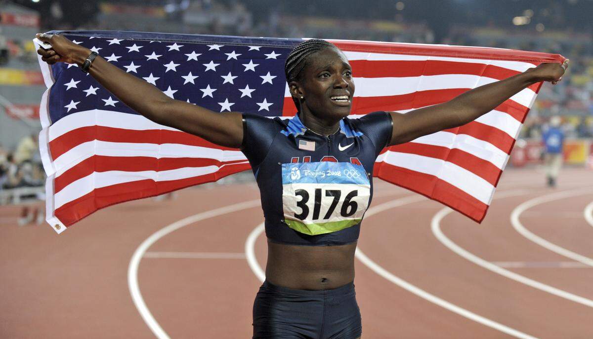 United States’ Dawn Harper celebrates winning the gold in the women’s 100-meter hurdles final in the National Stadium at the Beijing 2008 Olympics in Beijing, Tuesday, Aug. 19, 2008.