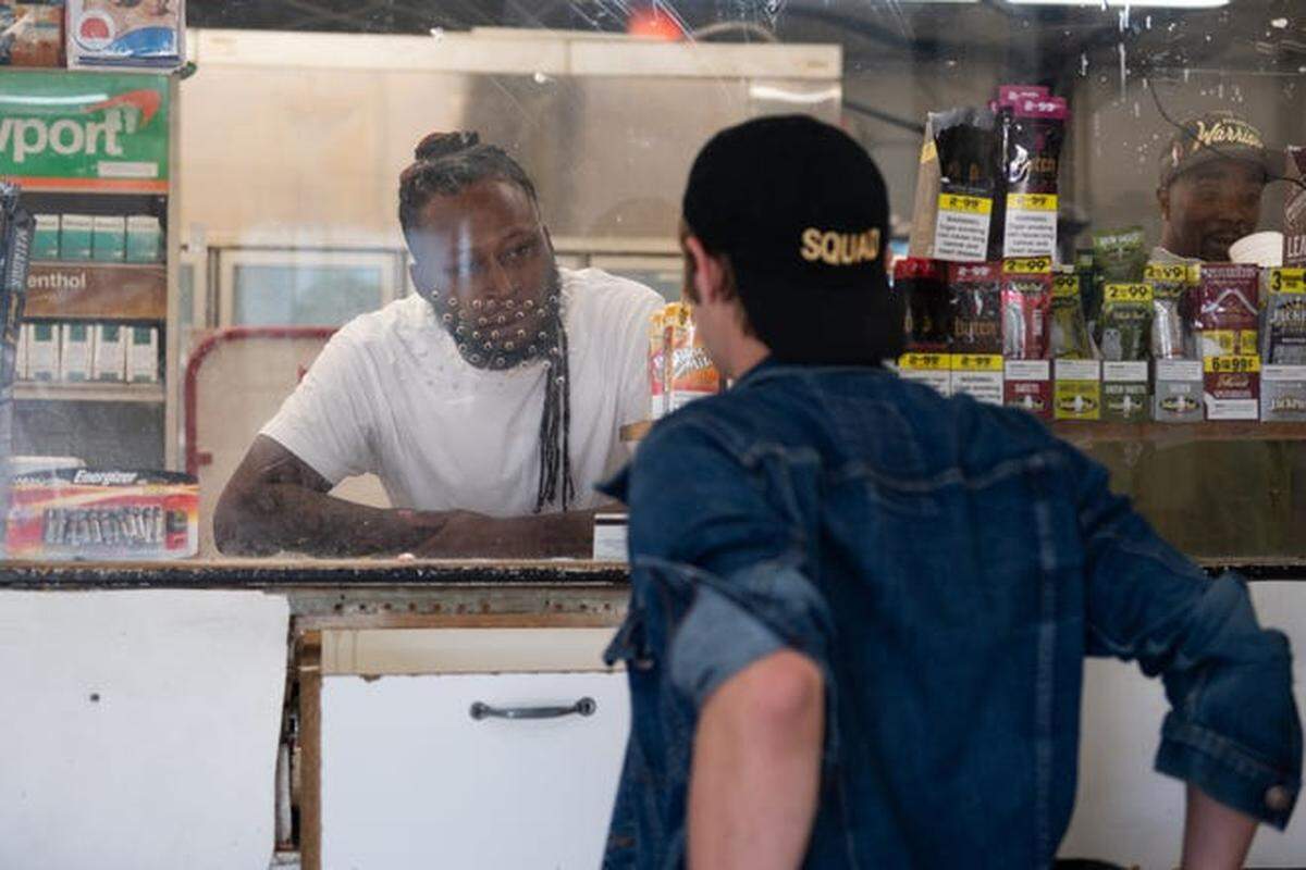 Rocky Miller speaks with a customer at Charlie’s.
