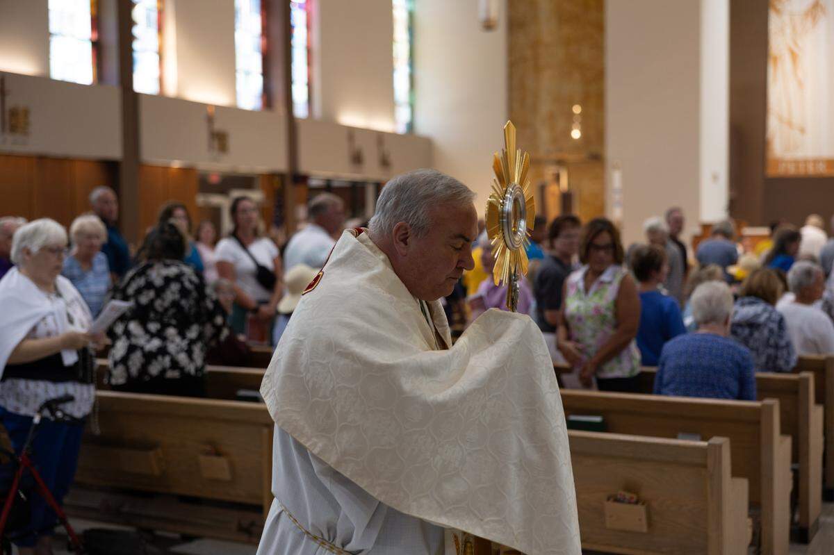 Bishop Michael G. McGovern joins a procession from St. Peter’s and Paul’s Catholic Church to a nearby cemetery of the same name in Collinsville on July 8, 2024.