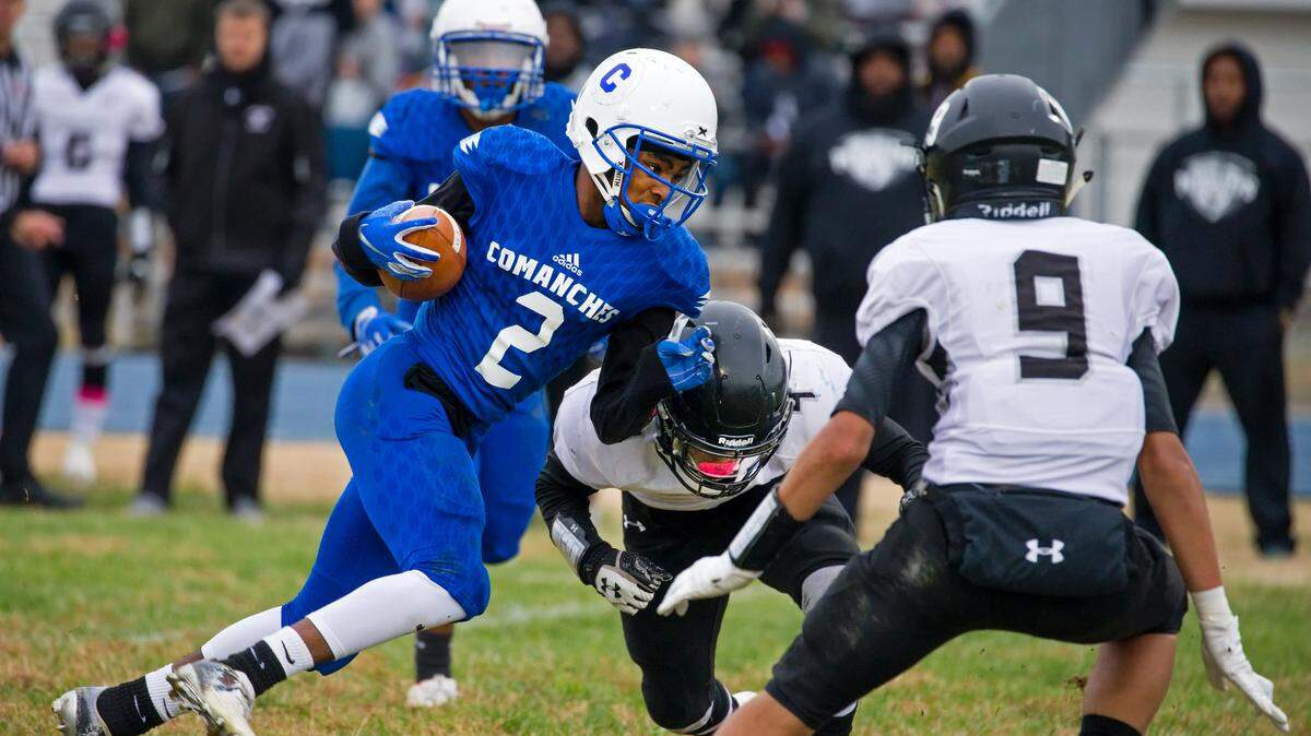 Cahokia’s Levauntez Conway ran the ball against the Carbondale defense during Saturday’s game at Cahokia High School.