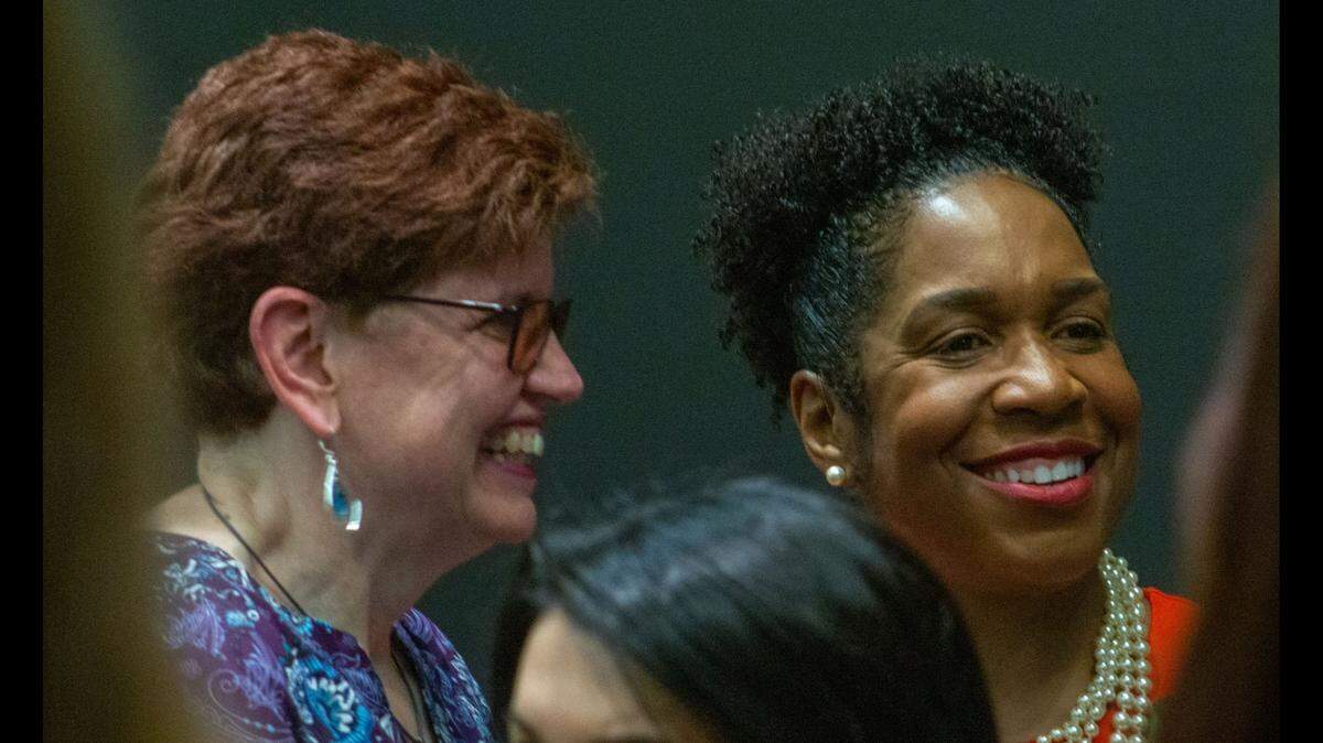 Lt. Gov. Juliana Stratton poses for a photo with Nanette Larson, a panelist and deputy director of wellness and recovery at the Division of Mental Health located within the Illinois Department of Human Services. Larson, who was hired 25 years ago, is one of the first people to be hired by the state because of her experience with mental health struggles.