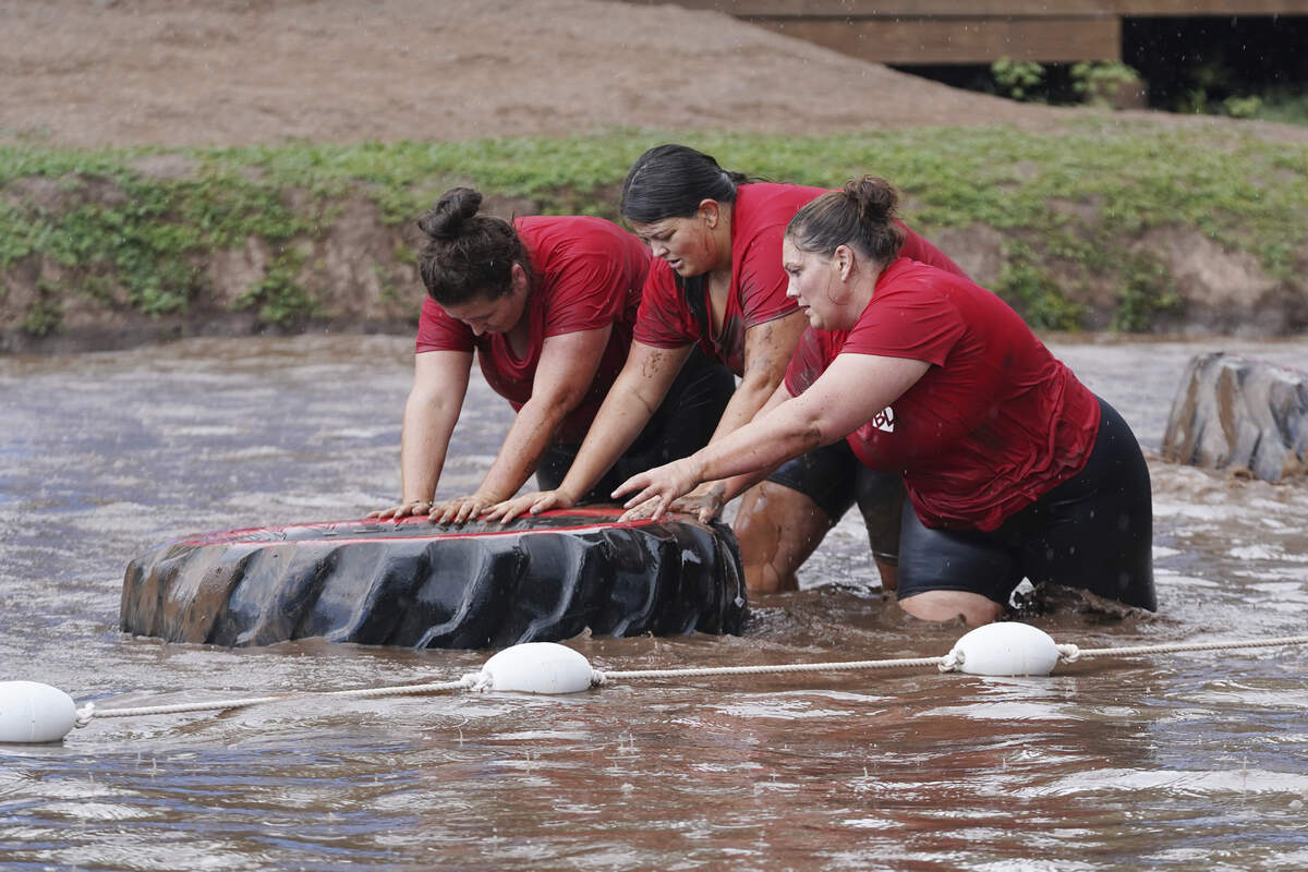 Contestants, left to right, Kristi McCart, of Riverview, Florida, Katarina Bouton, of Jacksonville, Florida, and Teri Aguiar, of Columbia, Illinois, participate in a water challenge on “The Biggest Loser.”