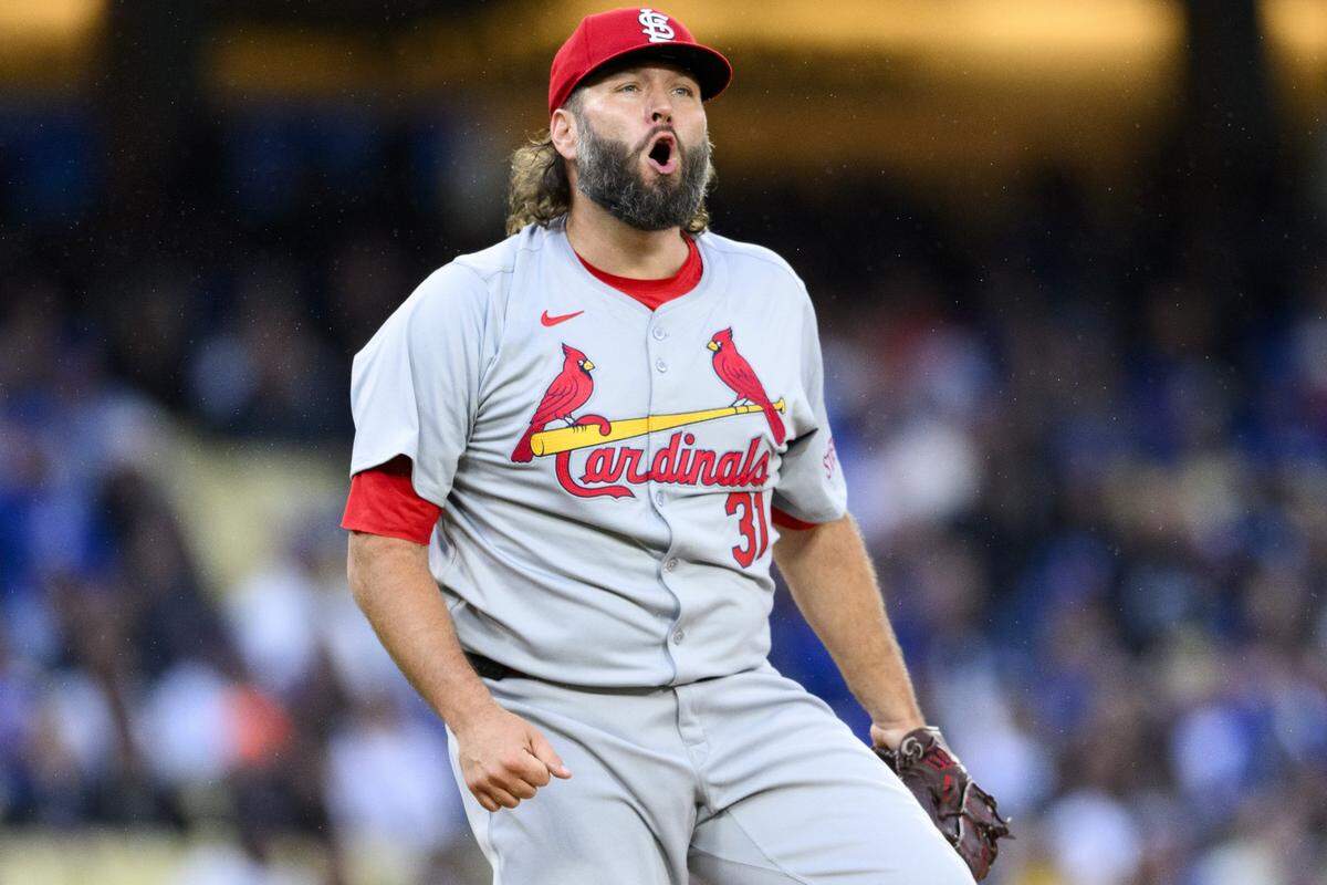 Mar 30, 2024; Los Angeles, California, USA; St. Louis Cardinals starting pitcher Lance Lynn (31) reacts after retiring the side with bases loaded during the first inning against the Los Angeles Dodgers at Dodger Stadium. Mandatory Credit: Kelvin Kuo-USA TODAY Sports