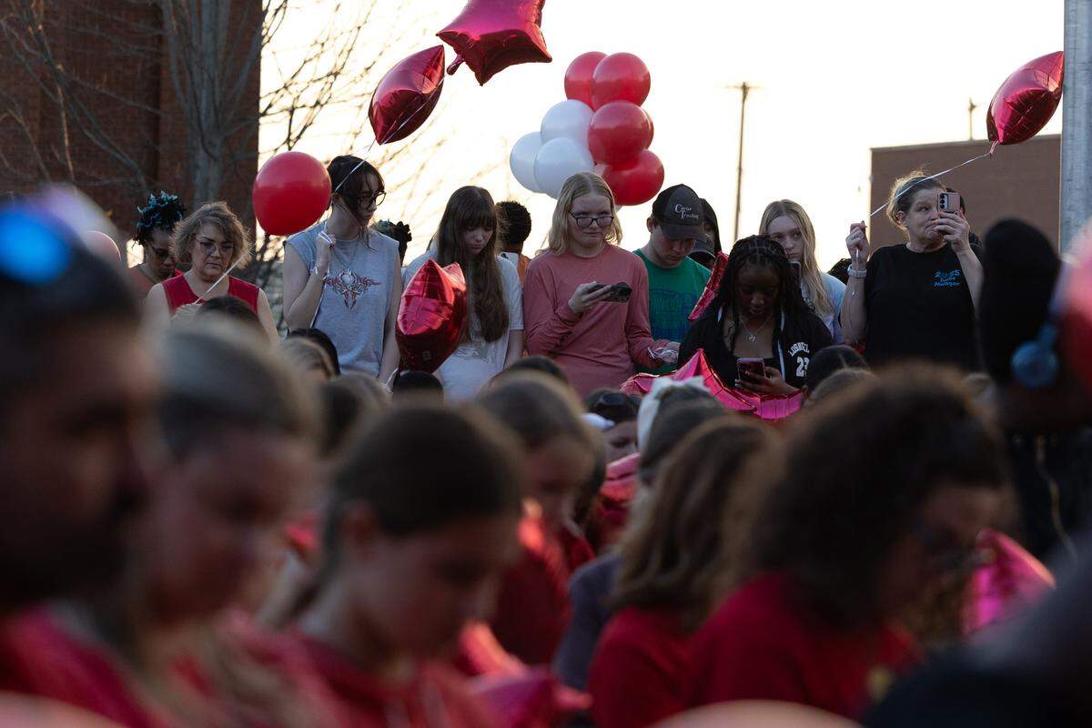 Belleville East students line up to release balloon in honor of fellow classmate Jarod Rhodes, who passed away last Friday unexpectedly.
