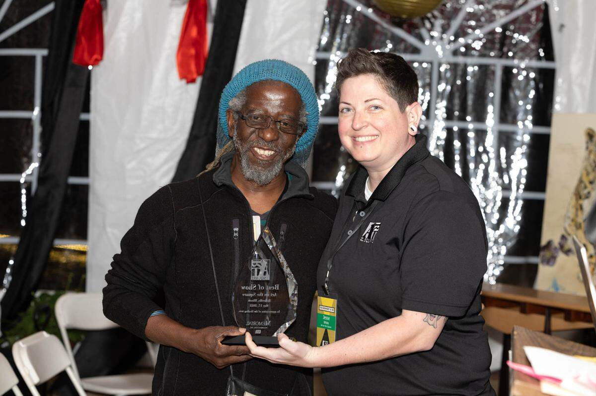 William Kwamena-Poh smiles as he accepts the Best in Show award during Saturday’s Art on the Square awards ceremony.