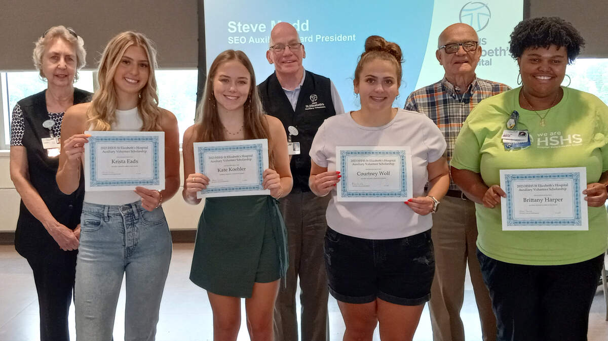 HSHS St. Elizabeth’s Hospital Auxiliary Volunteers announce the recipients of the 2023 HSHS St. Elizabeth’s Auxiliary Volunteer Scholarships. Back Row: Kathleen Mongiovi, Auxiliary Volunteer Board secretary; Steve Mudd, Auxiliary Volunteer Board president; and Mel Weck, Auxiliary Volunteer Board vice-president. Front Row: Scholarship award winners Krista Eads, Kate Koehler, Courtney Wolf and Brittany Harper. Not pictured: Scholarship award winner Lani Culley.