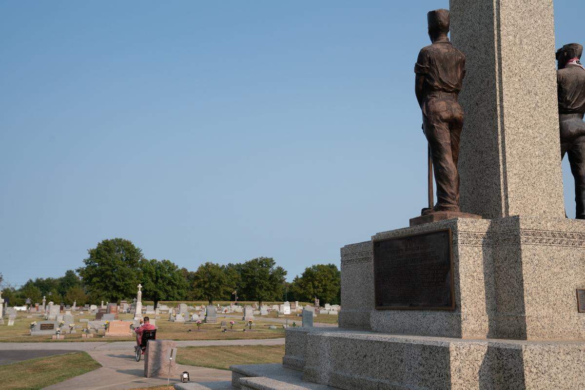 Residents of Mount Olive often visit the cemetery, including this one, who rode his bike through the serene monument on a warm September evening.