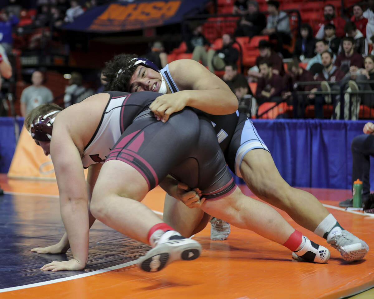 Belleville East’s Jonathan Rulo wrestles Elgin’s Adam Lambaz during their semifinal match at the 2023 IHSA Individual Wrestling State Finals on Friday. Rulo will wrestle in the championship match Saturday night.