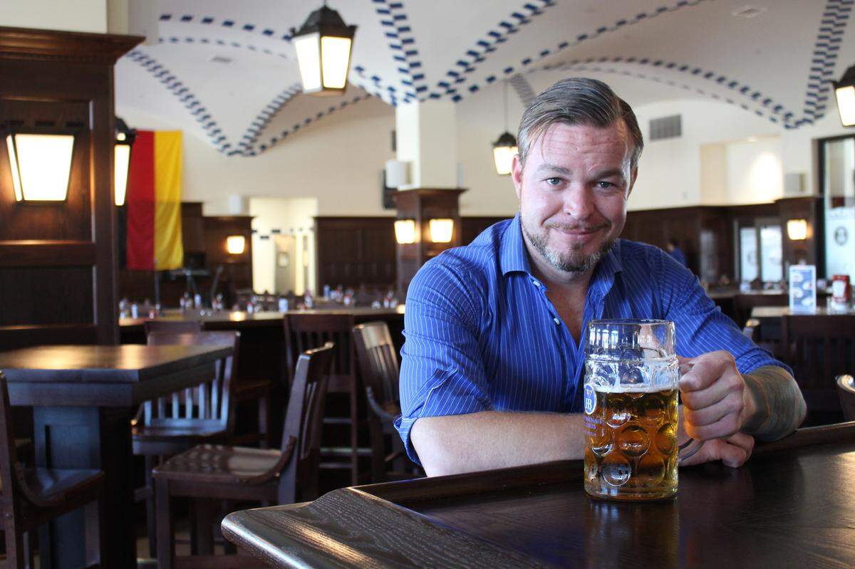 Matt Simmons, a Georgia attorney who recently took over as general manager of Hofbräuhaus St. Louis in Belleville, enjoys a beer at the German restaurant and brewery.