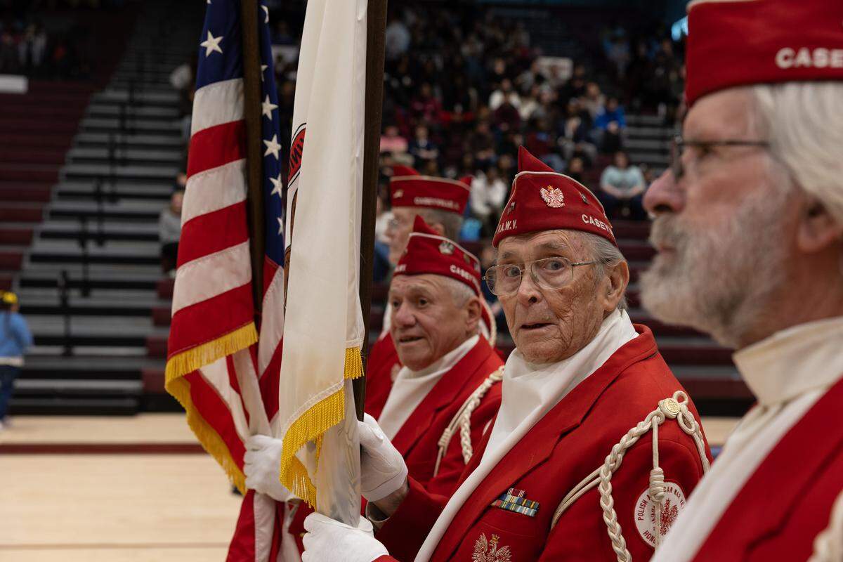 Members of the Polish-American War Veterans stand ready to perform colors prior to a naturalization ceremony at Belleville West High School Friday.