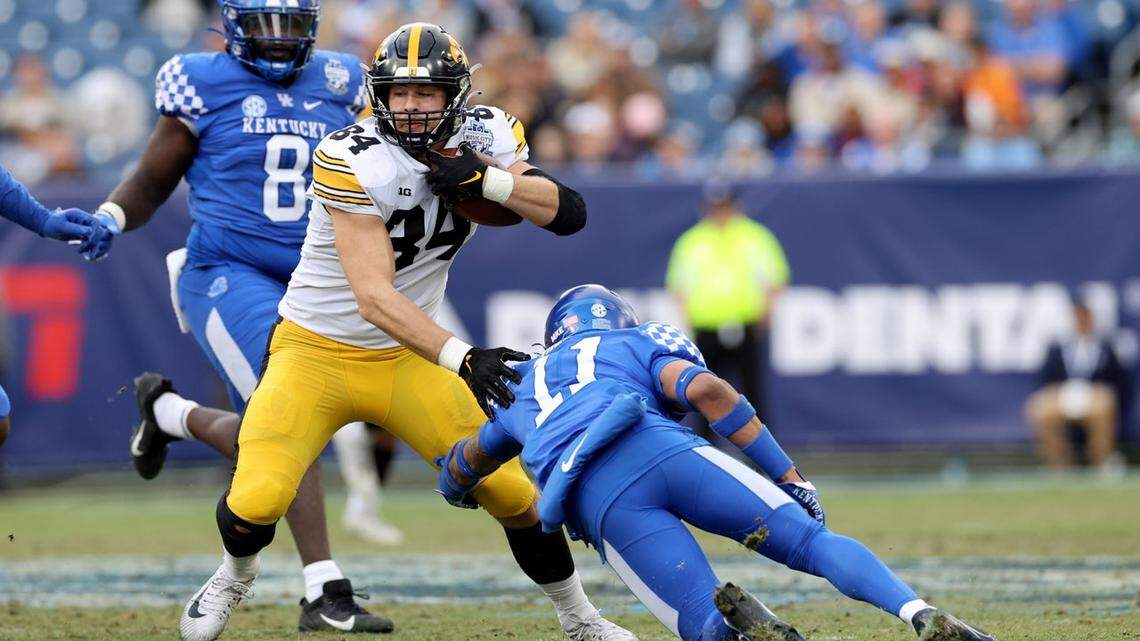 Iowa senior and Highland product Sam LaPorta heads upfield after hauling in a pass against Kentucky during the Music City Bowl on Dec. 31. LaPorta was selected in the second round of the NFL draft on Friday night.