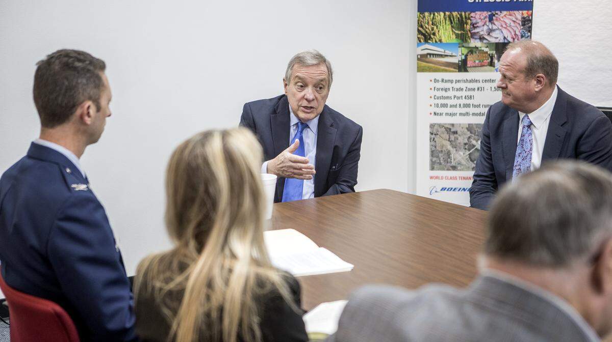 U.S. Sen. Dick Durbin, an Illinois Democrat, speaks with Colonel Joseph R. Meyer, Vice Commander, 375th Air Mobility Wing, Scott Air Force Base, Mark Kern, St. Clair County Board Chairman, area mayors and other officials during a discussion about the PFAS contamination at Scott AFB.