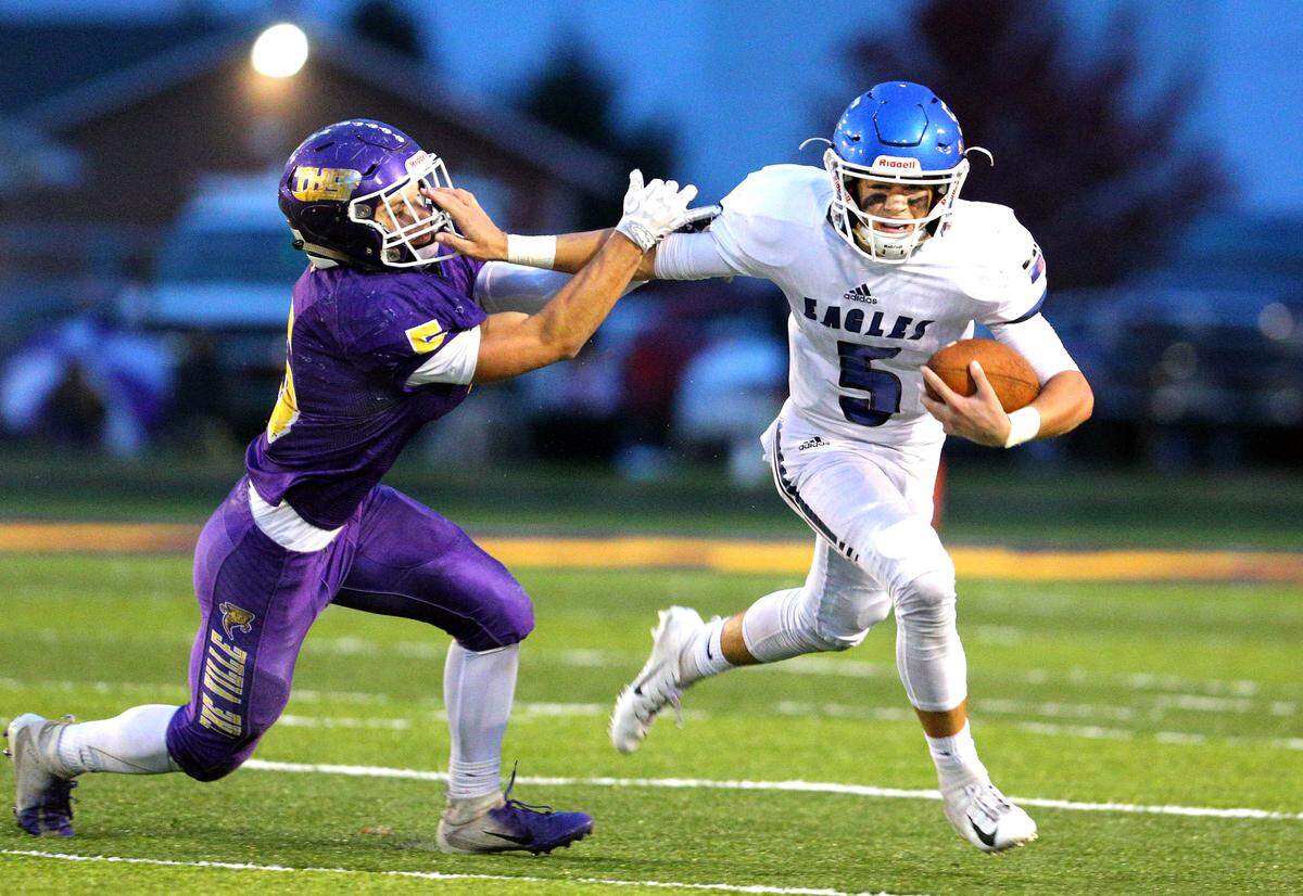 Columbia’s Nic Horner fights off a Tayorville defender during the second round IHSA Class 4A playoff game between Columbia and Taylorville Saturday in Taylorville.