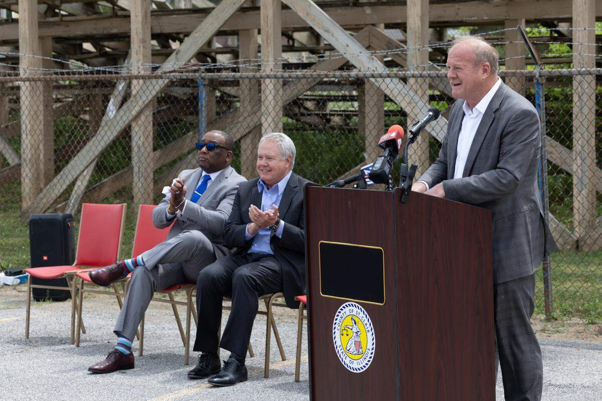 State Sen. Chris Belt, D-Swansea, and state Rep. Jay Hoffman, D-Swansea, sit while St. Clair County Board Chairman Mark Kern speaks about the upcoming renovations at the Belle-Clair Fairgrounds in Belleville, Ill., on June 18, 2024.