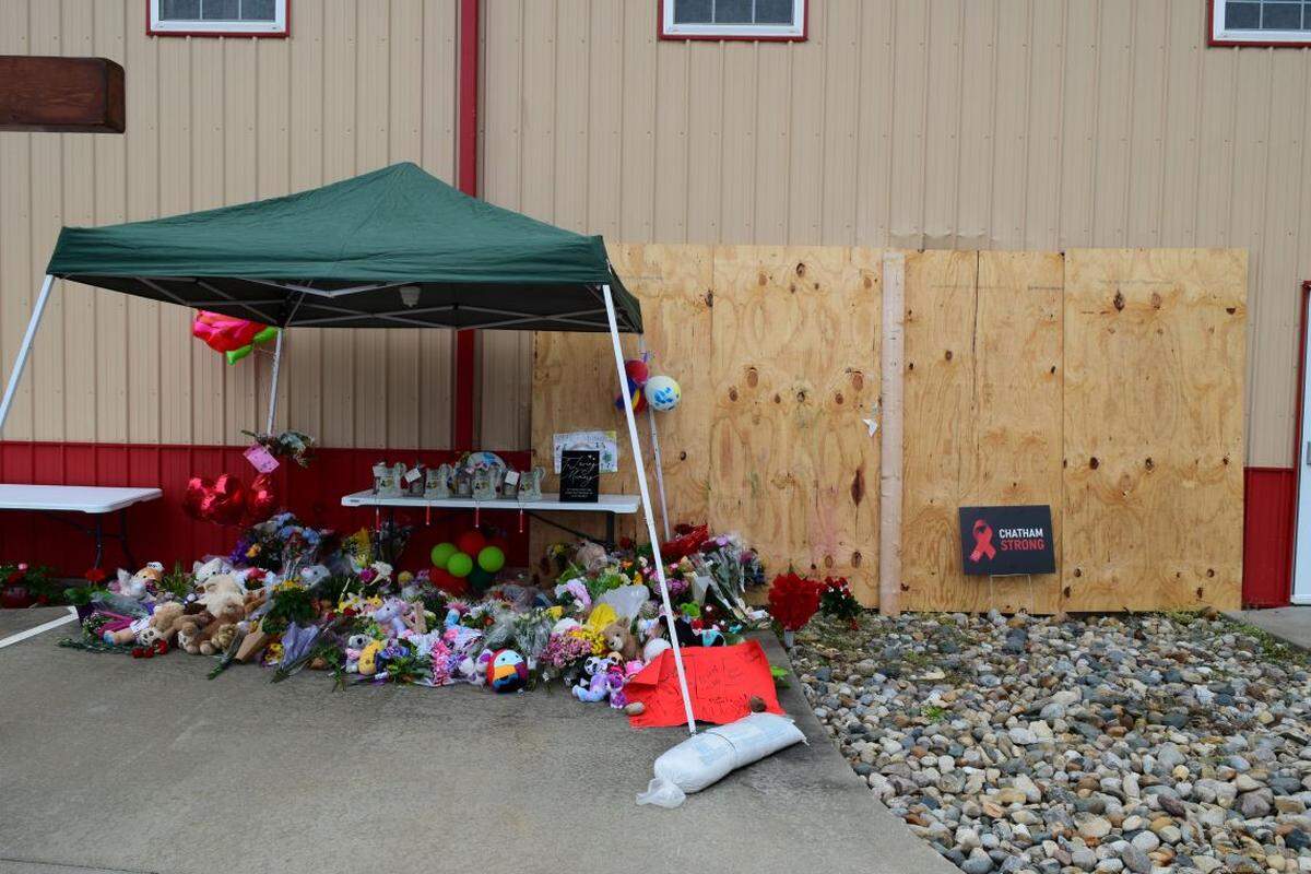 Residents created a memorial at the site where three children and a teen died when a Jeep crashed through an after-school program in Chatham.
