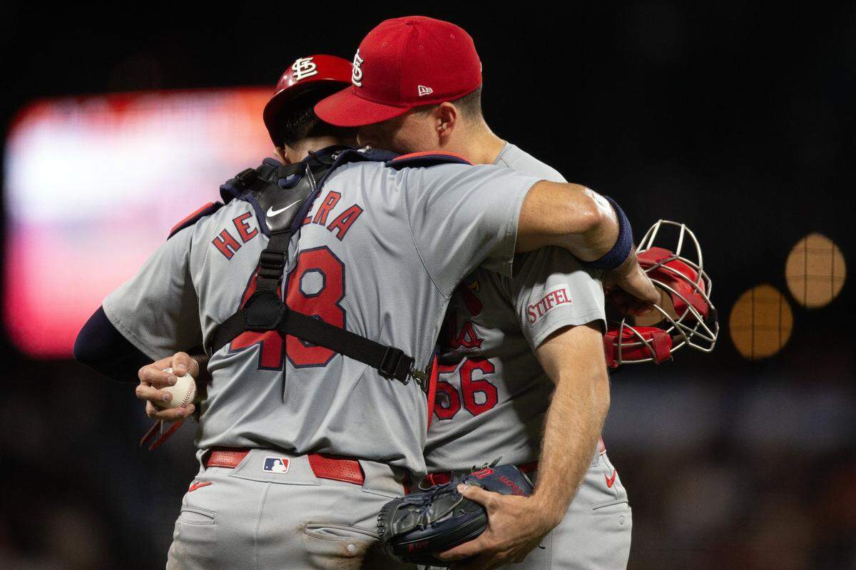 Sep 27, 2024; San Francisco, California, USA; St. Louis Cardinals catcher Ivan Herrera (48) and pitcher Ryan Helsley (56) celebrate their 6-3 victory over the San Francisco Giants at Oracle Park. Mandatory Credit: D. Ross Cameron-Imagn Images