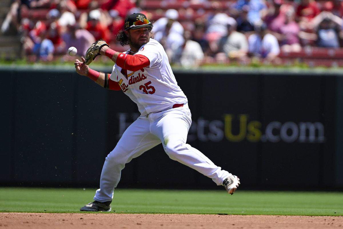 May 19, 2024; St. Louis, Missouri, USA;  St. Louis Cardinals shortstop Brandon Crawford (35) loses grip of the baseball after making a diving play against the Boston Red Sox during the third inning at Busch Stadium. Mandatory Credit: Jeff Curry-USA TODAY Sports