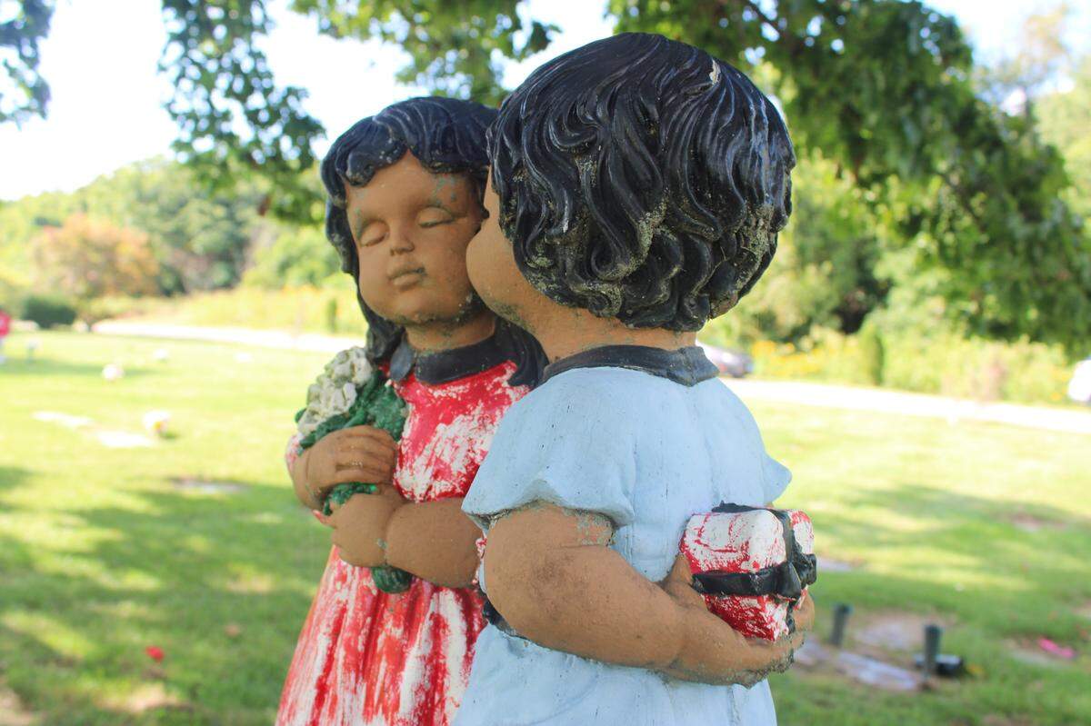 More than 30 years ago, Johnnie Haire, grounds supervisor at Sunset Gardens of Memory cemetery in Millstadt, Illinois, set up a birdbath and purchased angel figurines for a special garden for deceased children called “Baby Land.” He carefully painted each angel a hue of brown. He says he wanted the angels to be Black, like many of the children laid to rest here. (Cara Anthony/KHN)