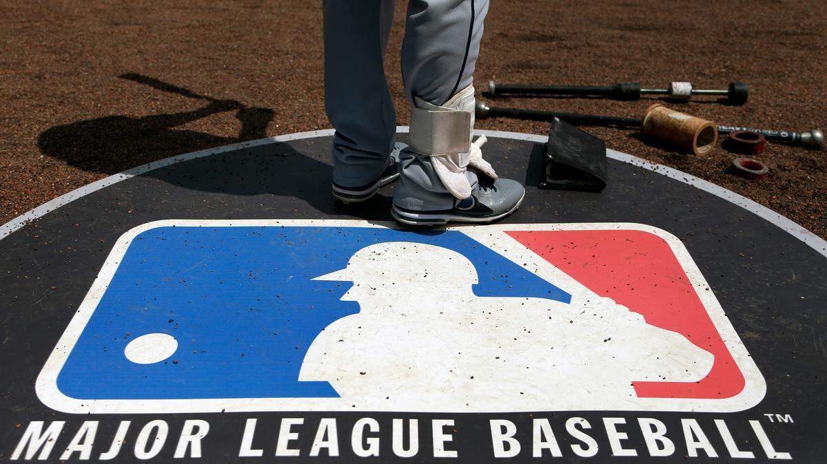 FILE - In this April 24, 2013, file photo, Cleveland Indians second baseman Jason Kipnis stands on the Major League Baseball logo that serves as the on deck circle during the first inning of a baseball game between the Chicago White Sox and the Indians, in Chicago. Major League Baseball rejected the players’ offer for a 114-game regular season in the pandemic-delayed season with no additional salary cuts and told the union it did not plan to make a counterproposal, a person familiar with the negotiations told The Associated Press. The person spoke on condition of anonymity Wednesday, June 3, 2020, because no statements were authorized.(AP Photo/Charles Rex Arbogast, File)