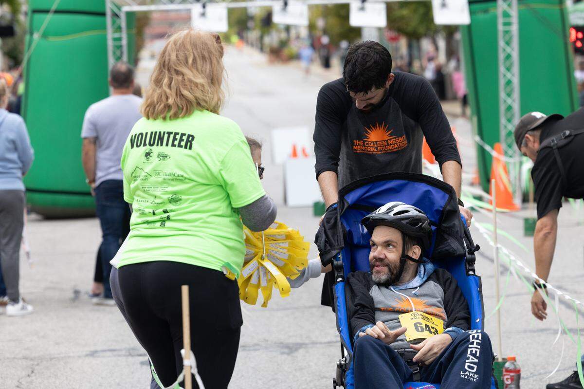 Ben Godard pushes his brother-in-law Chris Moosman at the Belleville Marathon on Sept. 28, 2024. While the pair often go running together, this is the first official race they’ve done together. “Special people make people special,” Godard said.