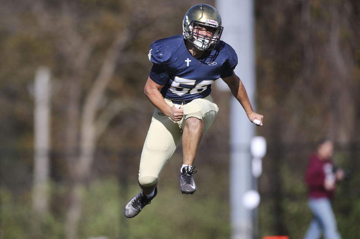 Althoff’s Luke Gundlach celebrates after a fumble recovery during an IHSA Class 2A second round playoff game against Red Bud. The Crusaders prevailed 26-14 and now advance to the quarterfinal round.