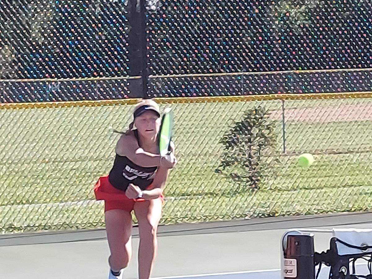 Highland’s Addisoi Crask returns a shot toward the net during her No. 2 singles match against Waterloo on Monday, Sept. 12, at Highland High School. Waterloo ultimately prevailed 6-3.