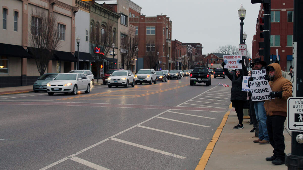 About 25 people rally outside the Madison County Courthouse on Jan. 19, 2022, in support of a Madison County Board resolution “denouncing” COVID-19 vaccine mandates.