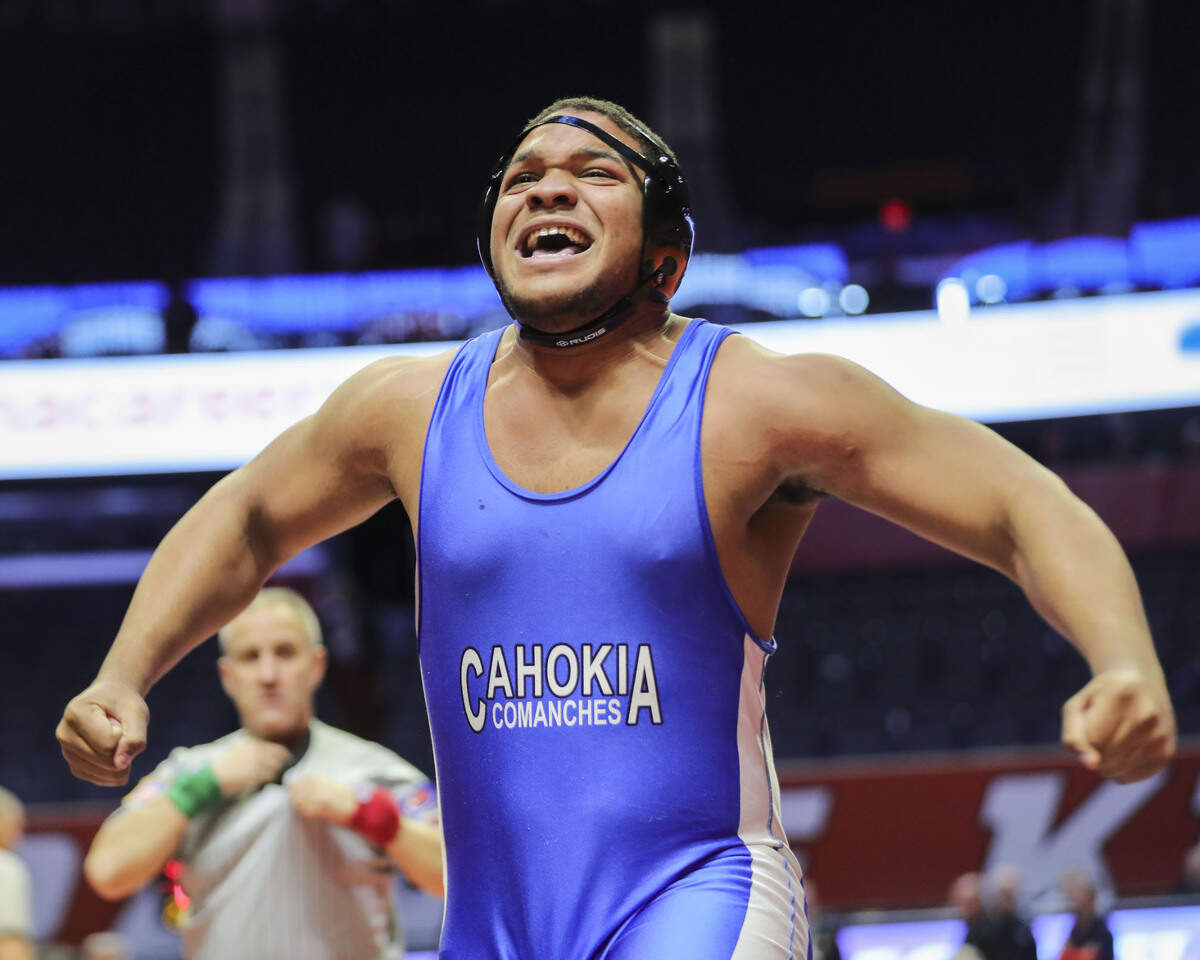 Cahokia’s Jason Dowell celebrates after pinning Reed-Custer’s Gunnar Berg in the third place match at the 2023 IHSA Individual Wrestling State Finals on Saturday.