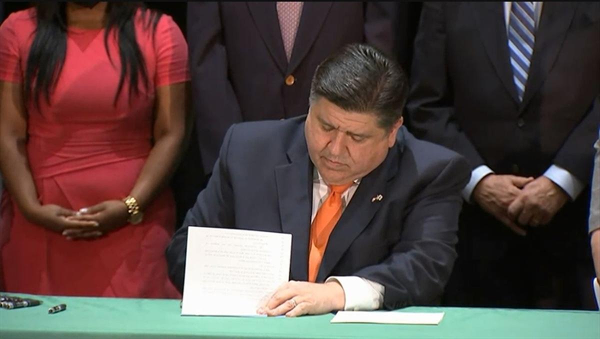 Gov. J.B. Pritzker signs two bills into law aimed at protecting victims of sexual assault during a signing ceremony Thursday in Chicago.