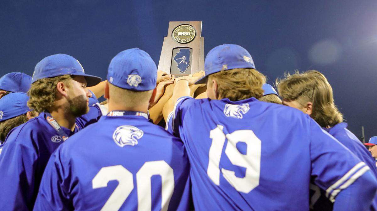 Columbia players raise the second place trophy after suffering a 4-2 loss in Saturday’s IHSA Class 2A state championship game against Joliet Catholic Academy at Dozer Park in Peoria. The Eagles finished their tremendous season at 34-5.