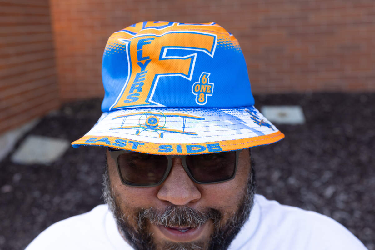 East St. Louis Mayor Charles Powell III dons an East St. Louis Flyers bucket hat during the 618 Day/Juneteenth celebration in East St. Louis on June 18.