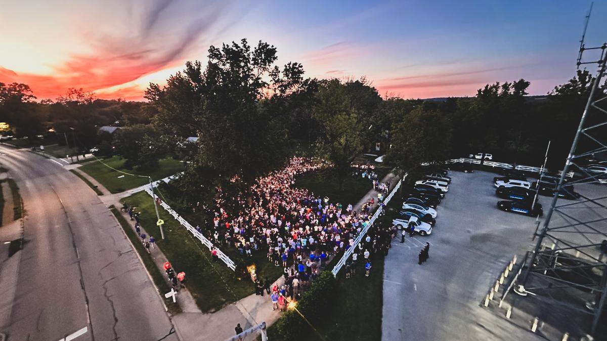 Hundreds gathered at a candelight vigil in Columbia, Ill., Monday evening to mourn the death of Crawford Bryant, a sophomore at the high school who died in a car crash Sunday.