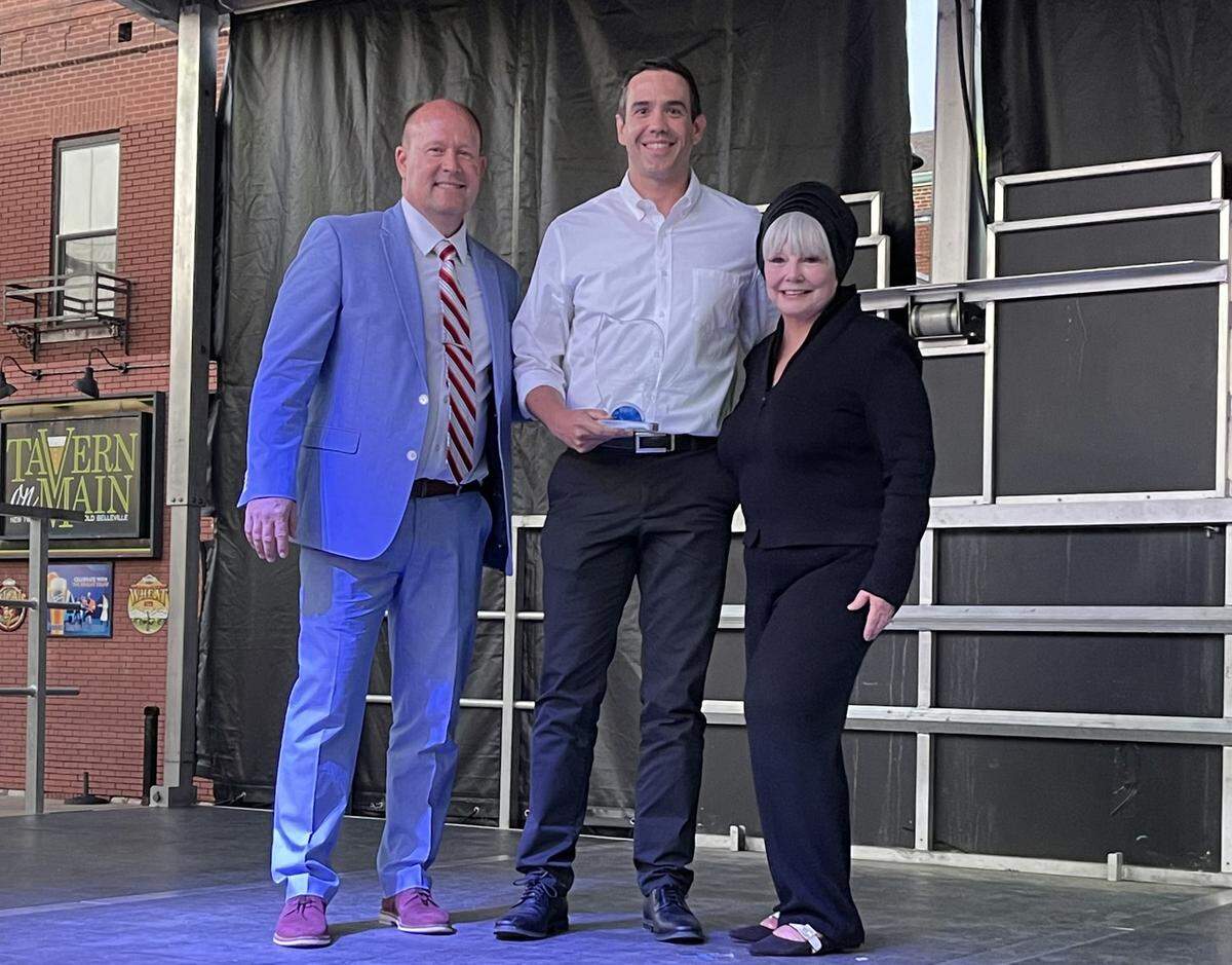 Award presenter and Belleville Public School District 118 superintendent Dr. Ryan Boike, Jared Katt, president of Chelar Tool & Die, and Belleville Mayor Patty Gregory