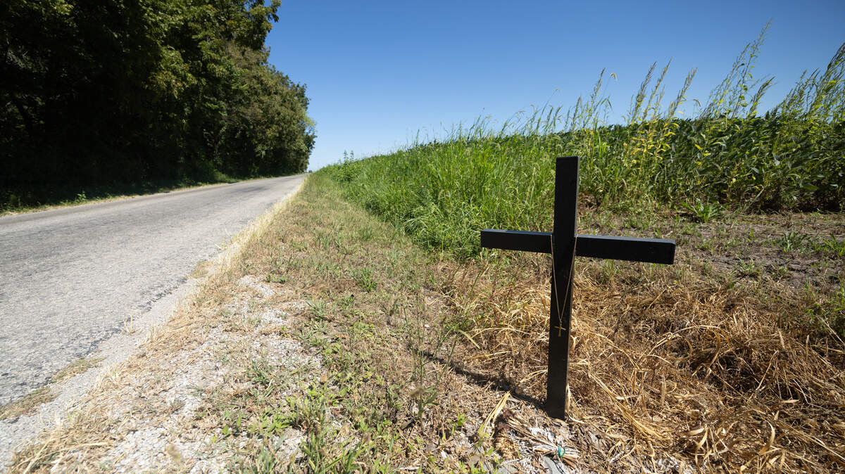 This file photo shows a roadside sign along Clinton County Line Road to memorialize those who died in a nearby three-car crash in May 2025. Here’s what to know about roadside memorial rules in Illinois.