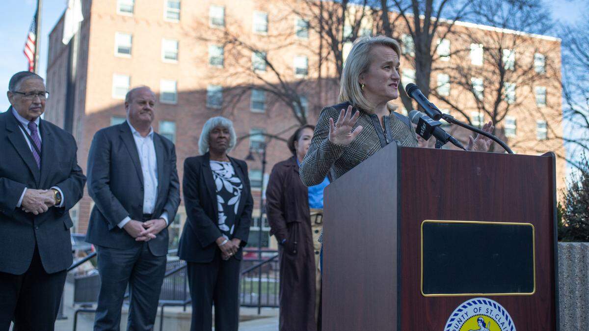 U.S. Rep. Nikki Budzinski speaks to the press regarding an $89.5 million federal relief package to address flooding issues while elected officials of St. Clair County look on outside of St. Clair County courthouse on Jan. 29, 2025.