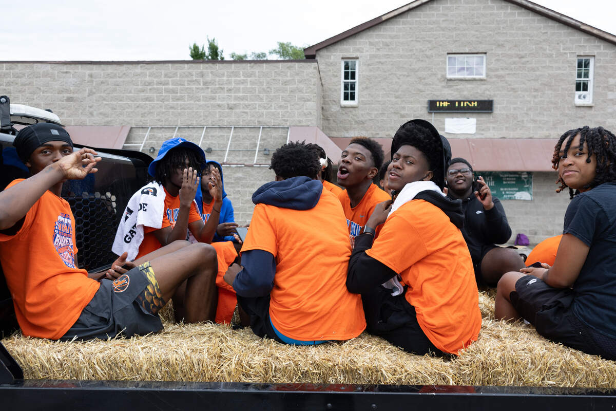 Members of the East St. Louis Flyers basketball team participate in a parade during a 618 Day/Juneteenth celebration in East St. Louis on June 18.