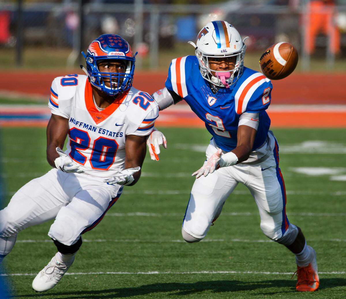 East St. Louis Antonio Johnson (2) knocks down the pass intended for Hoffman Estates Daivon Mclin during Saturday’s game at East St. Louis High School.