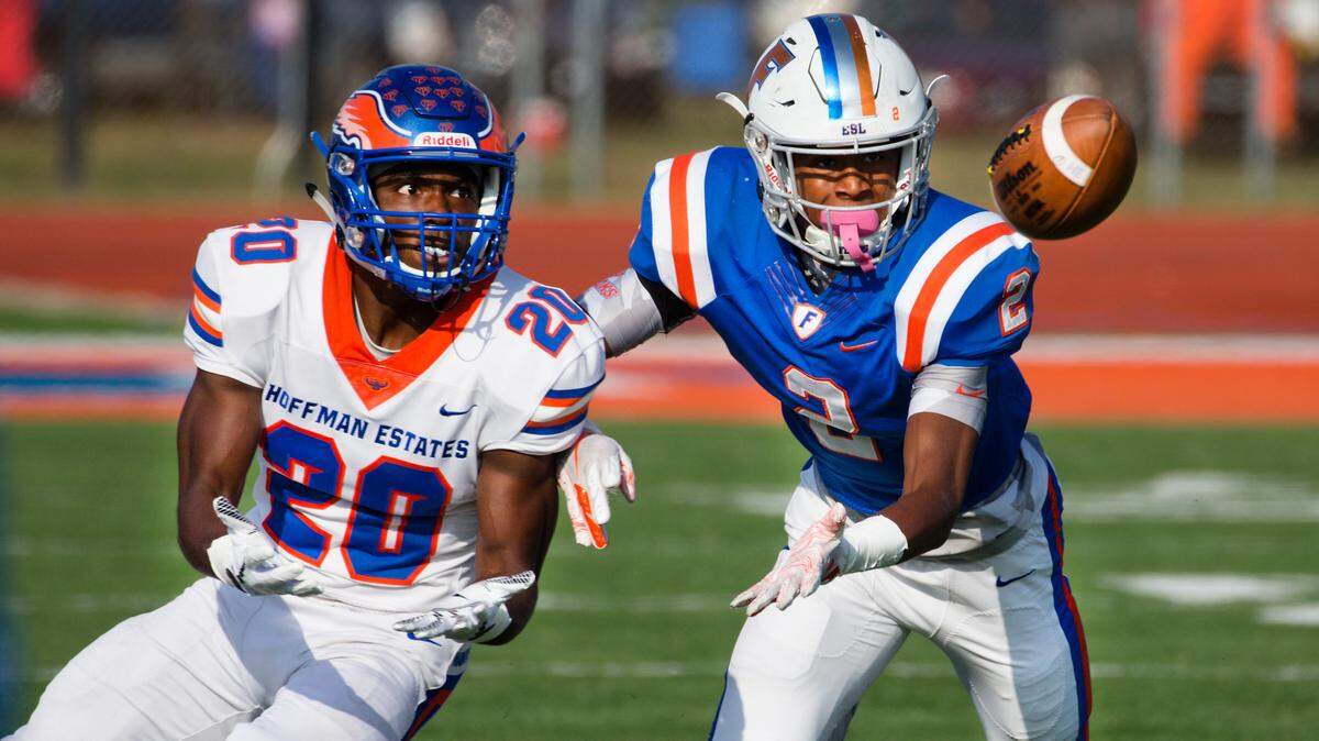  East St. Louis Antonio Johnson (2) knocks down the pass intended for Hoffman Estates Daivon Mclin during Saturday’s game at East St. Louis High School.
 