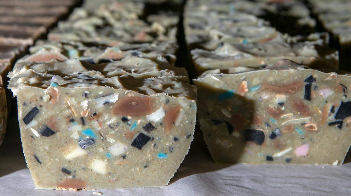Small-batch, handmade soaps rest on a drying rack at the new headquarters for Waterfall Glen Soap Co. in Belleville.