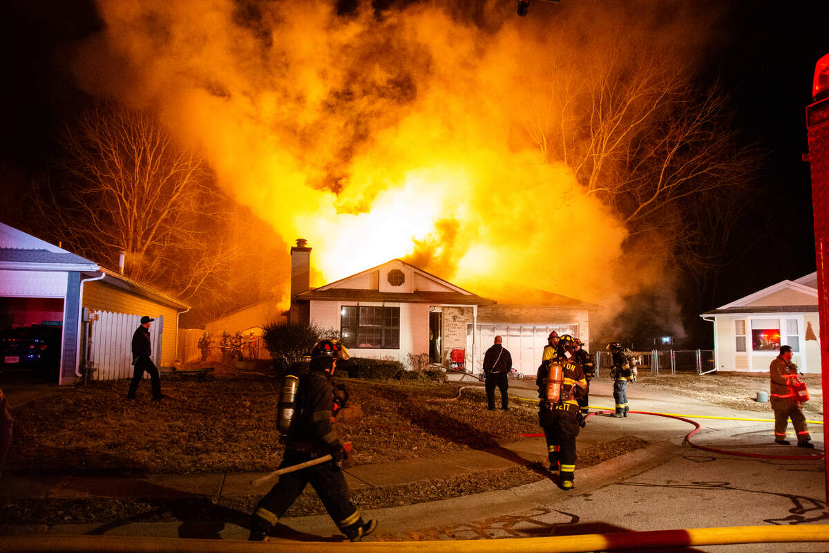 Firefighters battle a blaze on Royal Oak Court early Friday in O’Fallon. The Illinois State Fire Marshal was called to investigate.