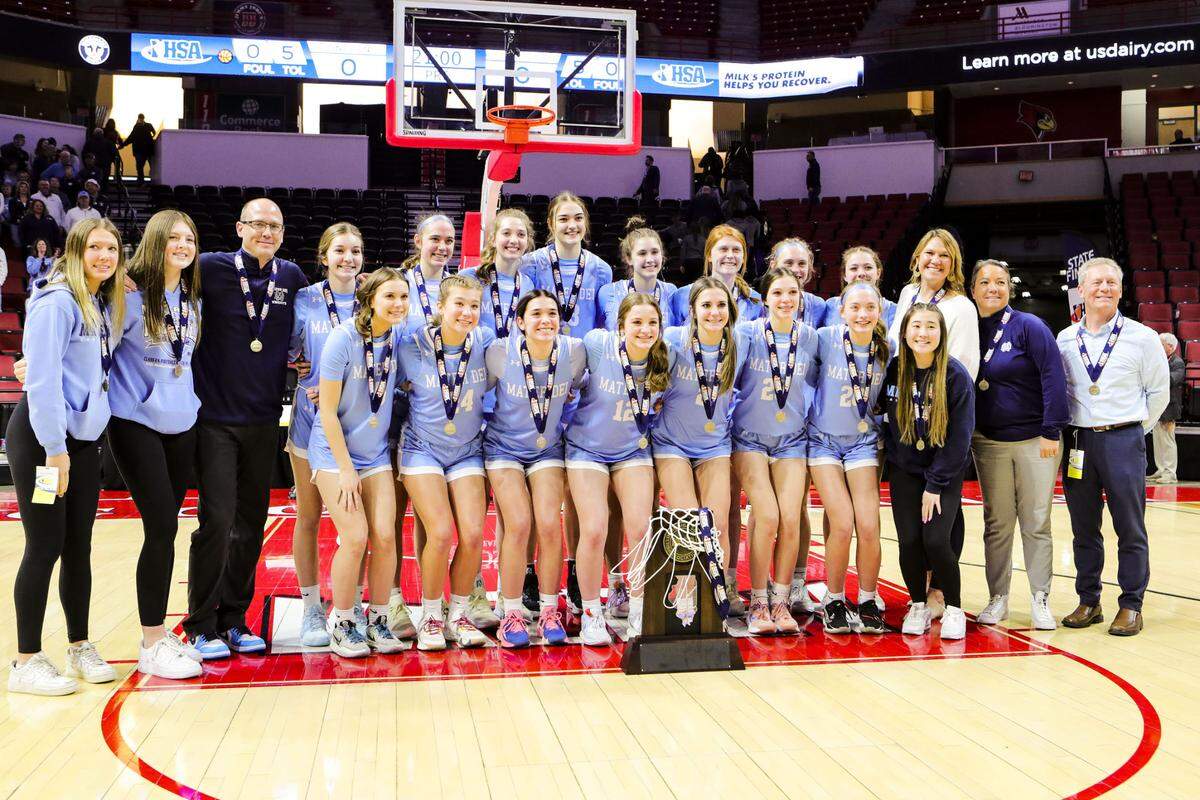 Mater Dei’s IHSA Class 2A state champions pose for a team picture after defeating Byron 62-46 at CEFCU Arena (formerly Redbird Arena) on the campus of Illinois State University.